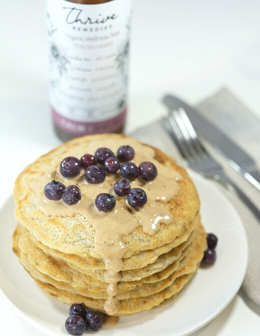 vegan-pancakes-recipe vegan pancakes with a bottle of calm tea in the background